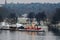 Old red lighthouse ship Biskopsudden moored at pier on Djurgarden during winter in Stockholm, Sweden