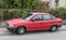 Old red Opel Astra sedan car parked