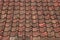 Old red and orange weathered roof tiles texture