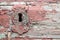 Old red paint rusty antique door keyhole or lock