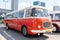 The old red Skoda bus rides through the streets of the Polish capital. Tourist bus vintage model. The street of the old