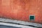 Old red tile wall and sloping street in Hong Kong