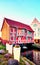 Old red timbered house with shining flower pots in Wismar. Mecklenburg-Vorpommern, Germany