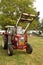 Old red tractor with lifting equipment