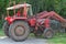 Old red tractor with loader