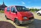 Old red van Ford Transit parked