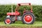 A old red vintage massey ferguson 148 tractor