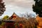 Old red wooden building of Kiyomizu Kannon-do shrine in Ueno park, Tokyo in autumn