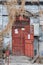 Old red wooden door of a traditional hutong residential building, Beijing