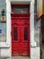 Old red wooden doors of apartment house