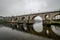 Old Reflected Bridge in the river