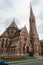 Old reformed church in Budapest with brick and colorful tile and medieval style, Hungary. Arch entrance and historic facade