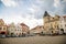 Old Renaissance Town hall with clock tower and Hussitism museum on main square, Late gothic tracery gable on historical building,