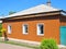 Old renovation house with new plastic siding walls and old asbestos roof.