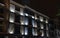 Old restored brick facade with lighting in the central square ca