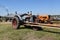 Old restored Case tractor hooked to a belt for power