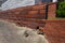 Old retaining walls of brick, hollow red ceramic square tube, and concrete