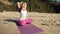 Old retired woman doing some yoga on the beach super slow motion