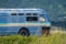 Old retro abandoned bus sits along in a marsh along the Homer Spit in the Kachemak Bay Area of Alaska