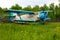 Old retro airplane on green grass