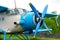 Old retro airplane on green grass