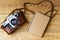 Old retro camera on vintage rustic wooden planks boards. Education photography courses back to school concept abstract background