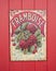 Old Retro Enamel Framboise sign on a red wooden Background