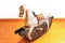 Old retro rocking horse on an gold colored wooden floor