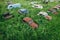 Old retro rusty abandoned cars in high green grass, cemetery of vintage autos, aerial view