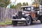 Old retro rusty truck on the road in the rain