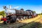 Old retro steel locomotive train standing on the rails in Livingstone, Zambia