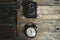 Old retro typewriter, alarm clock and camera on a wooden background top view