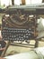 Old retro unnecessary faulty typewriter, professional writer equipment