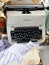 Old retro unnecessary faulty typewriter, professional writer equipment