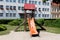 Old retro vintage outdoor wooden public playground equipment with climbing steps and dilapidated plastic slide
