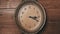 Old Retro Wall Clock with Moving Second Hand on Wooden Background