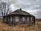 An old rickety dilapidated residential log wooden house