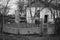 Old rickety fence with open gates in a rural yard