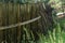 Old rickety wooden fence with support