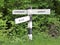 Old road sign with directions to Commonwood, Belsize and Sarratt in Hertfordshire