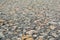 The old road, small stones and asphalt close up with a small depth of field.