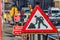 Old Roadworks Sign on a Pavement