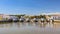 Old Roman Bridge at low tide, Tavira, Portugal.