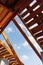 Old roof renovation, frame of the roof against blue sky background