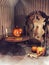 Old room with Halloween pumpkins and magic items