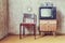 Old room. retro tv, chair and cassette player