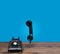 Old rotary dial telephone on wooden desk with copy space