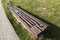 an old rotting wooden bench in the park