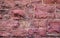 Old rough red stone and tuckpointing masonry wall background