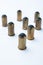 Old rubber bullets on a white background, selective focus